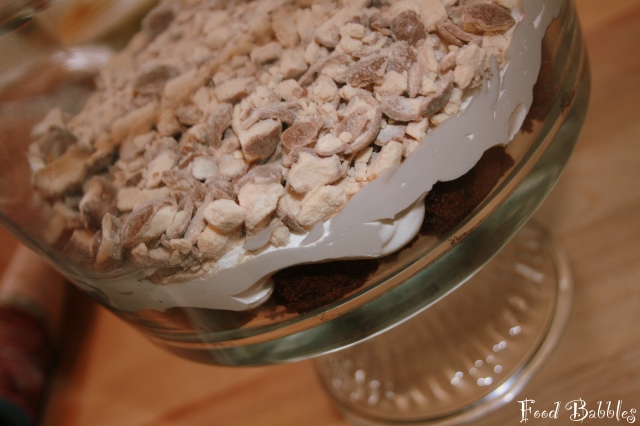 Cake, whipped cream, Whoppers... making something delightful!